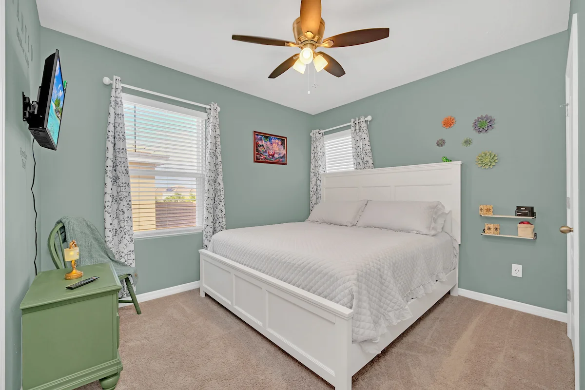 Tangled themed bedroom with artwork and cozy bed